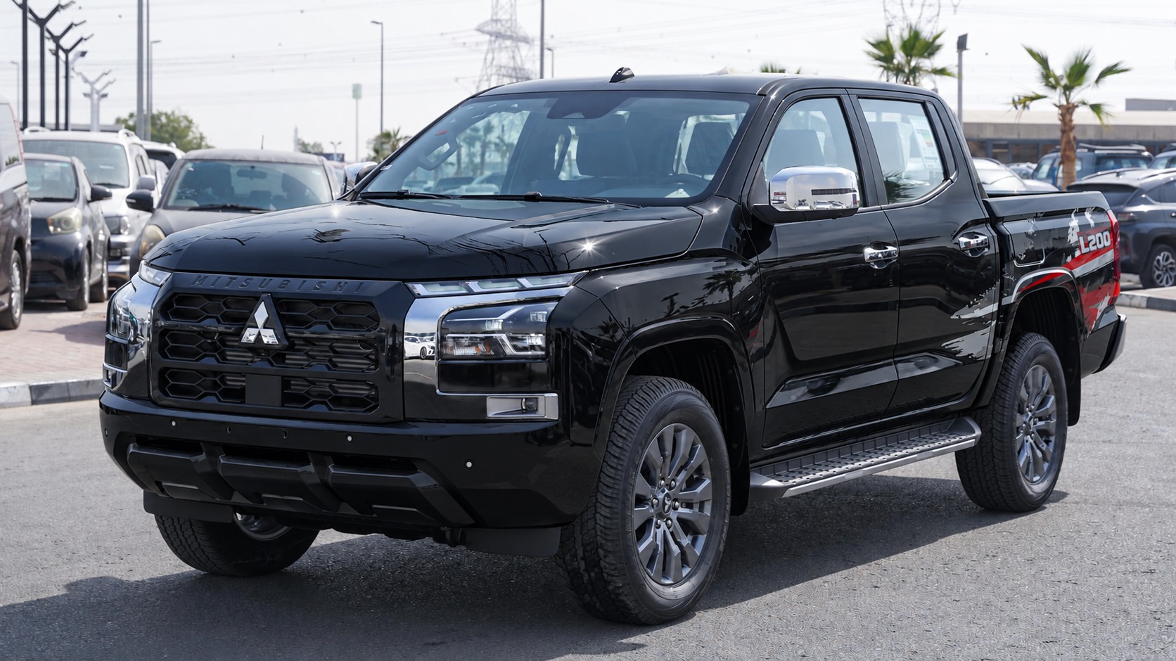 Вид спереди на чёрный Mitsubishi L200 GLS